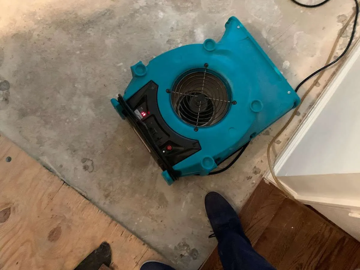 Air mover drying subfloor during Commercial Water Damage Restoration in Tucson Estates